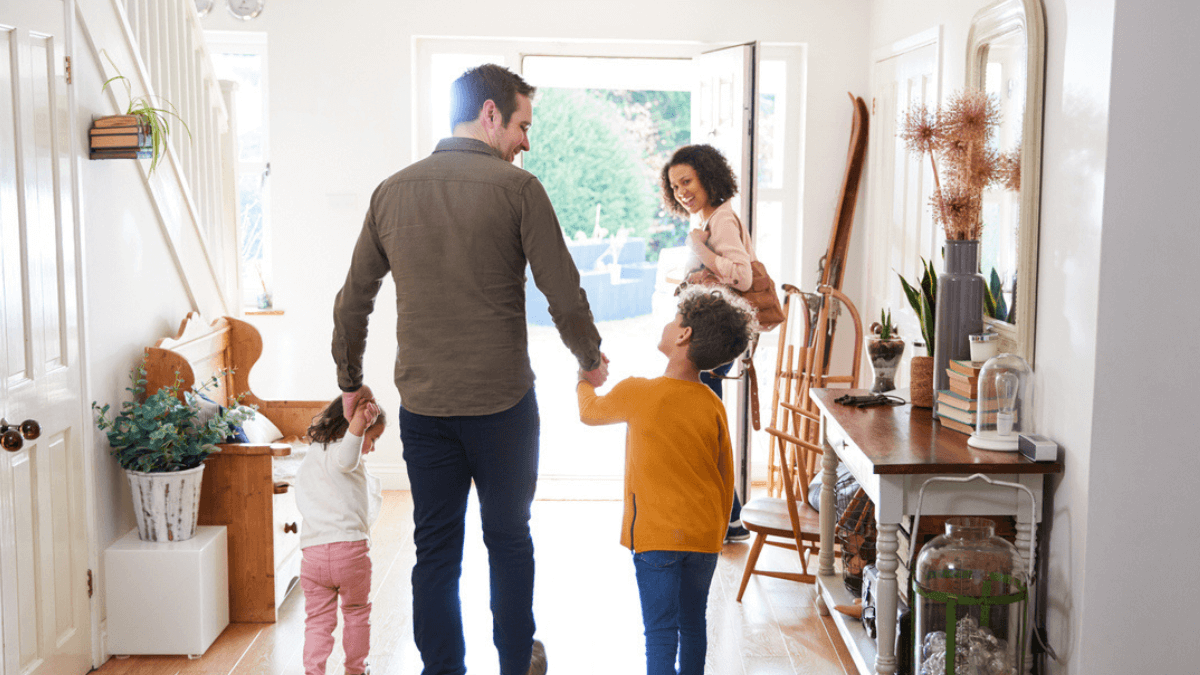 Family walks through door with smart lock