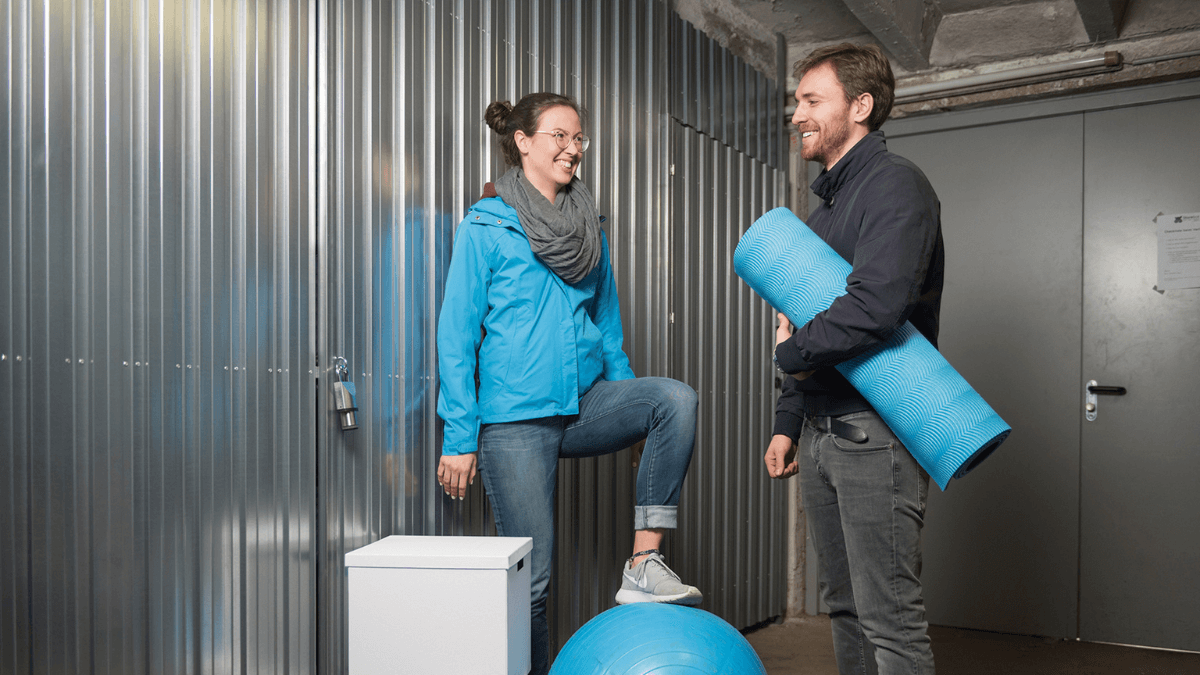 Two people in a self-storage warehouse.